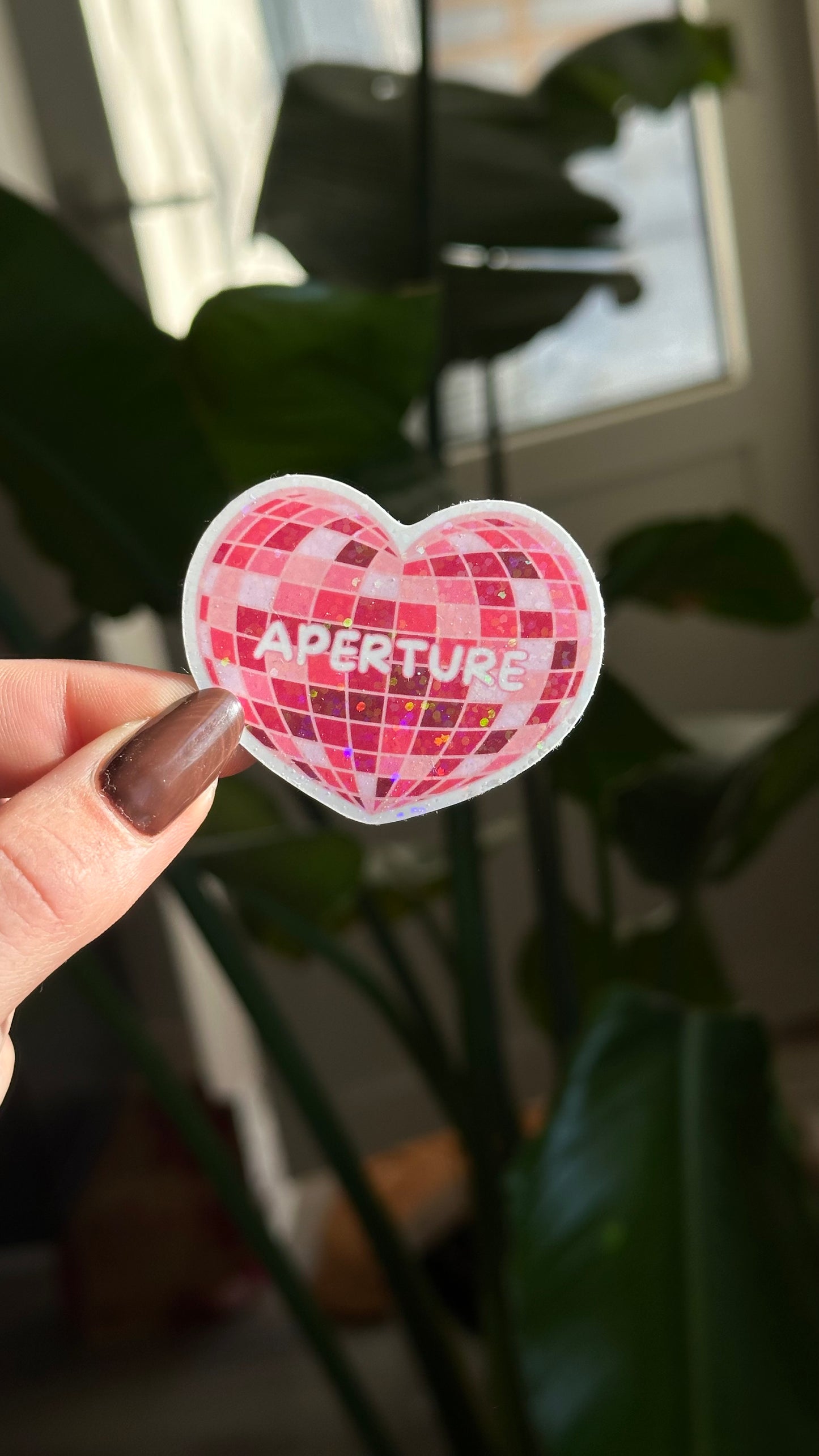 Aperture glitter sticker
