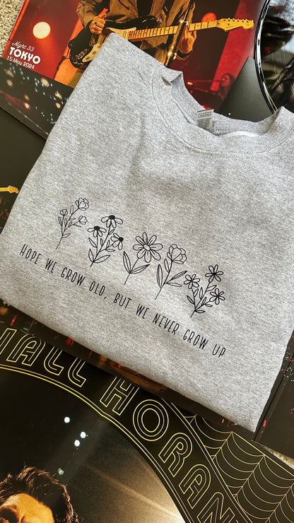 Never grow up crewneck